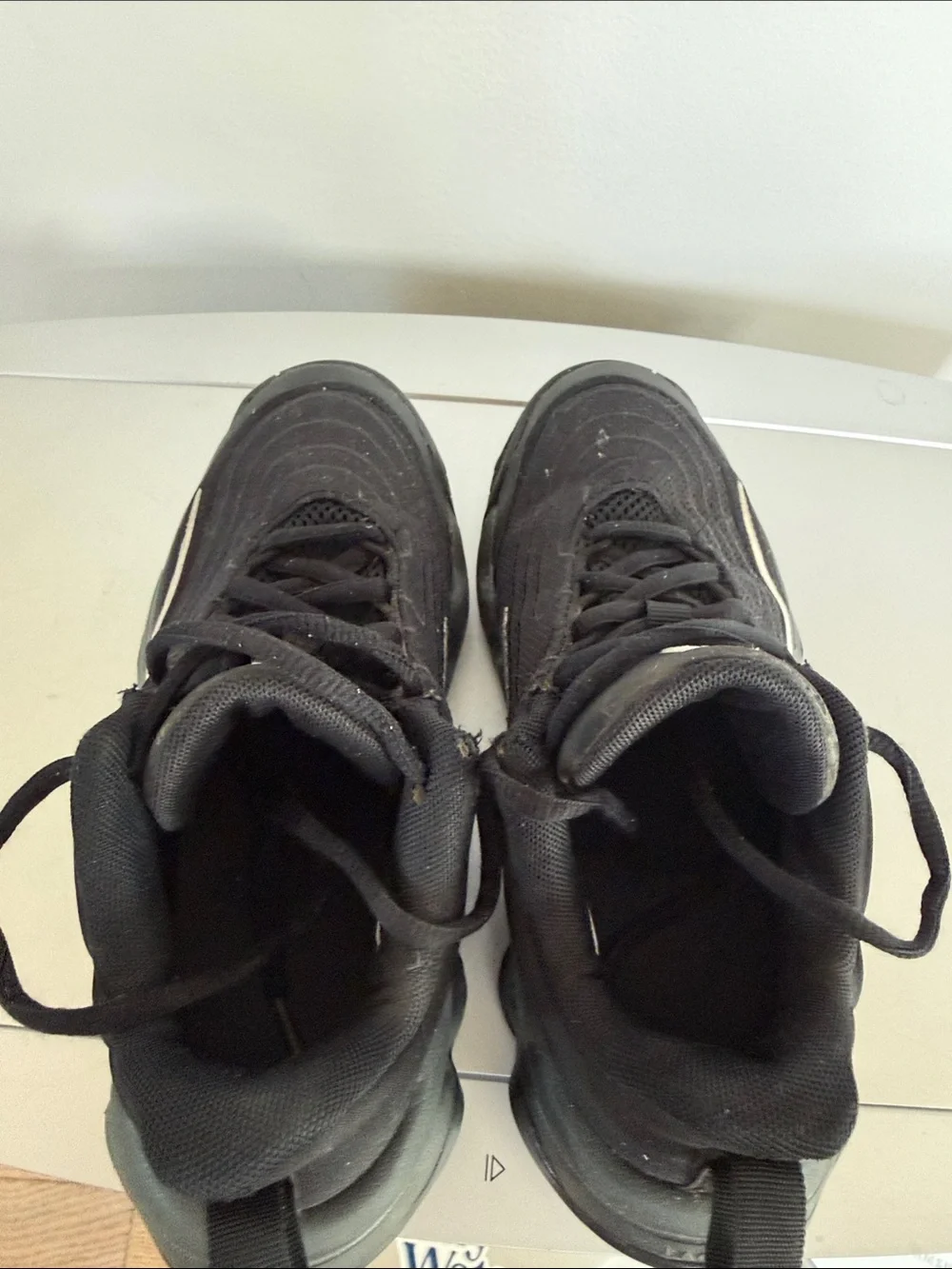 Nike Black Sneakers with White Swoosh Accent
